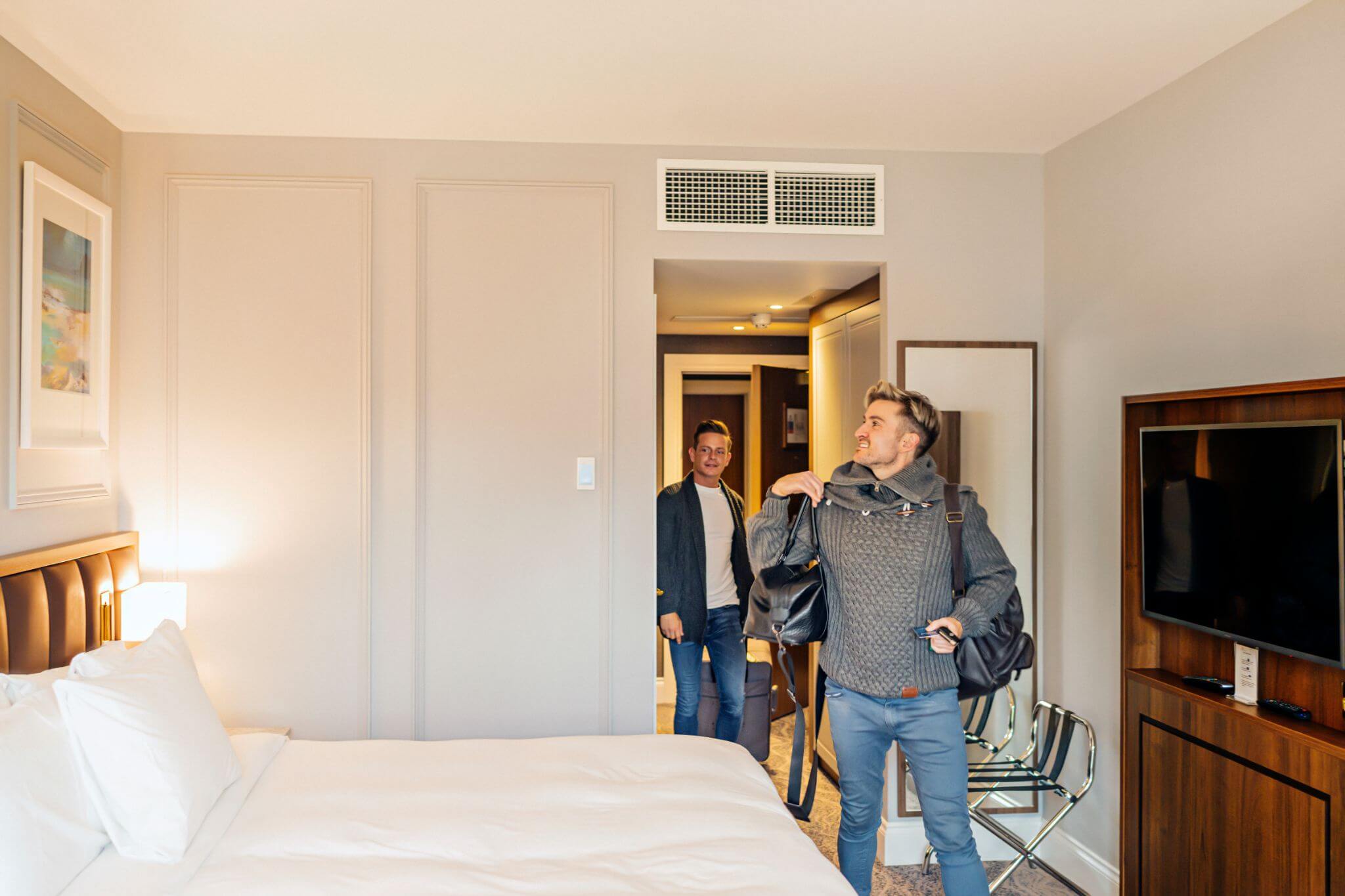 A couple entering their hotel room at the Ness Walk Hotel.